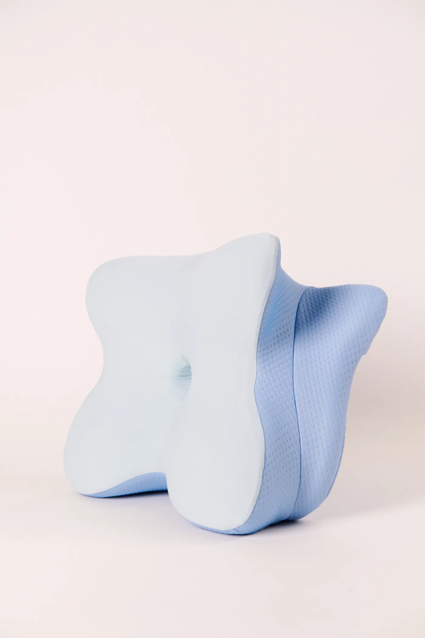 Top-down view of the butterfly-shaped ergonomic memory foam pillow